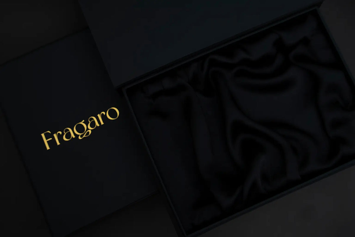 Black box with gold 'Fragaro' logo on a dark background